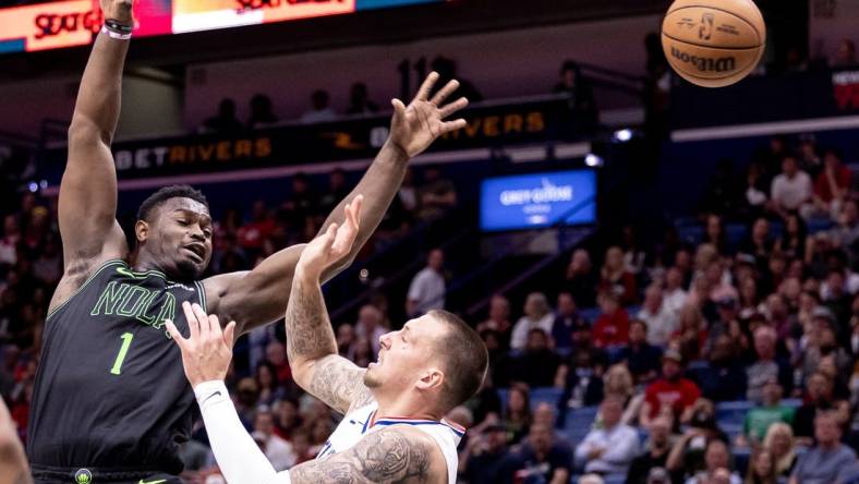 Mar 15, 2024; New Orleans, Louisiana, USA;  New Orleans Pelicans forward Zion Williamson (1) is fouled by LA Clippers center Daniel Theis (10) during the first half at Smoothie King Center. Mandatory Credit: Stephen Lew-USA TODAY Sports