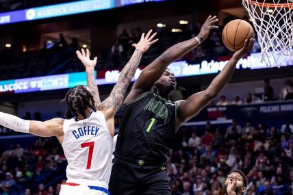 Mar 15, 2024; New Orleans, Louisiana, USA;  New Orleans Pelicans forward Zion Williamson (1) drives to the basket against LA Clippers guard Amir Coffey (7) during the first half at Smoothie King Center. Mandatory Credit: Stephen Lew-USA TODAY Sports