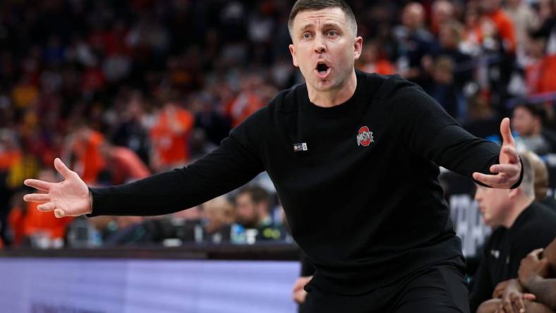 Mar 15, 2024; Minneapolis, MN, USA; Ohio State Buckeyes head coach Jake Diebler reacts to a call on the court during the second half against the Illinois Fighting Illini at Target Center. Mandatory Credit: Matt Krohn-USA TODAY Sports