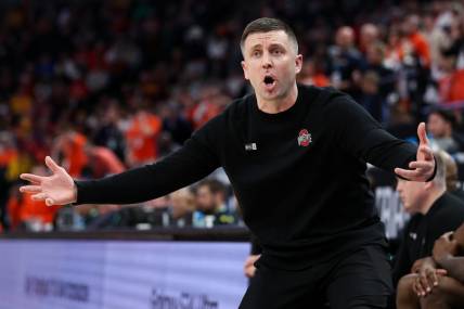 Mar 15, 2024; Minneapolis, MN, USA; Ohio State Buckeyes head coach Jake Diebler reacts to a call on the court during the second half against the Illinois Fighting Illini at Target Center. Mandatory Credit: Matt Krohn-USA TODAY Sports
