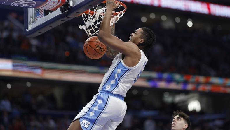 Mar 15, 2024; Washington, D.C., USA; North Carolina Tar Heels forward Armando Bacot (5) dunks the ball against the Pittsburgh Panthers in the second half at Capital One Arena. Mandatory Credit: Geoff Burke-USA TODAY Sports