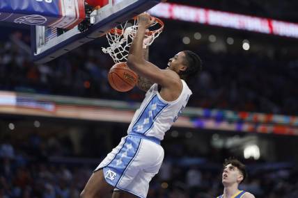 Mar 15, 2024; Washington, D.C., USA; North Carolina Tar Heels forward Armando Bacot (5) dunks the ball against the Pittsburgh Panthers in the second half at Capital One Arena. Mandatory Credit: Geoff Burke-USA TODAY Sports