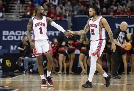 Mar 15, 2024; Kansas City, MO, USA; Houston Cougars guard Jamal Shead (1) celebrates with guard Emanuel Sharp (21) in the second half against the Texas Tech Red Raiders at T-Mobile Center. Mandatory Credit: Amy Kontras-USA TODAY Sports