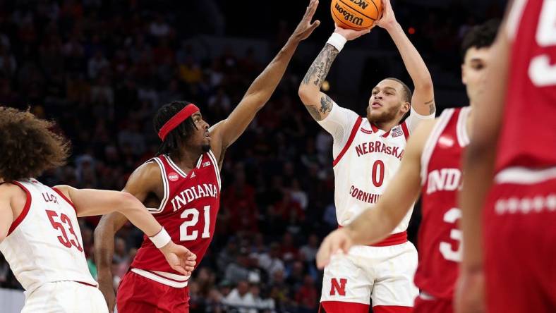 Mar 15, 2024; Minneapolis, MN, USA; Nebraska Cornhuskers guard C.J. Wilcher (0) shoots as Indiana Hoosiers forward Mackenzie Mgbako (21) defends during the first half at Target Center. Mandatory Credit: Matt Krohn-USA TODAY Sports