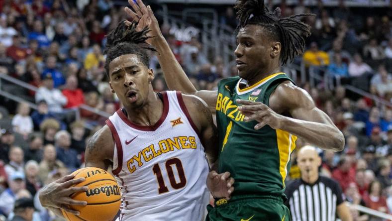 Mar 15, 2024; Kansas City, MO, USA; Iowa State Cyclones guard Keshon Gilbert (10) drives around Baylor Bears guard Ja'Kobe Walter (4) during the first half at T-Mobile Center. Mandatory Credit: William Purnell-USA TODAY Sports