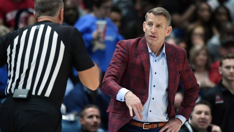 Mar 15, 2024; Nashville, TN, USA; Alabama Crimson Tide head coach Nate Oats questions a call by the officials during the second half against the Florida Gators at Bridgestone Arena. Mandatory Credit: Christopher Hanewinckel-USA TODAY Sports