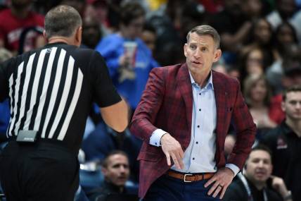 Mar 15, 2024; Nashville, TN, USA; Alabama Crimson Tide head coach Nate Oats questions a call by the officials during the second half against the Florida Gators at Bridgestone Arena. Mandatory Credit: Christopher Hanewinckel-USA TODAY Sports