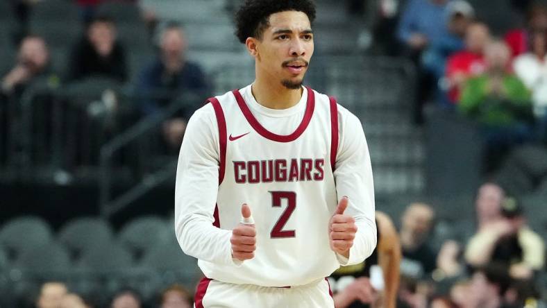 Mar 15, 2024; Las Vegas, NV, USA; Washington State Cougars guard Myles Rice (2) gestures after scoring against the Colorado Buffaloes during the first half at T-Mobile Arena. Mandatory Credit: Stephen R. Sylvanie-USA TODAY Sports