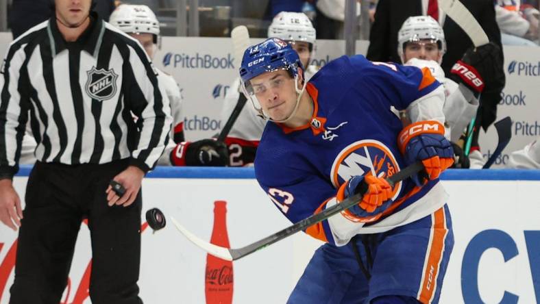 Mar 16, 2024; Elmont, New York, USA;  New York Islanders center Mathew Barzal (13) makes a pass against the Ottawa Senators during the second period at UBS Arena. Mandatory Credit: Thomas Salus-USA TODAY Sports