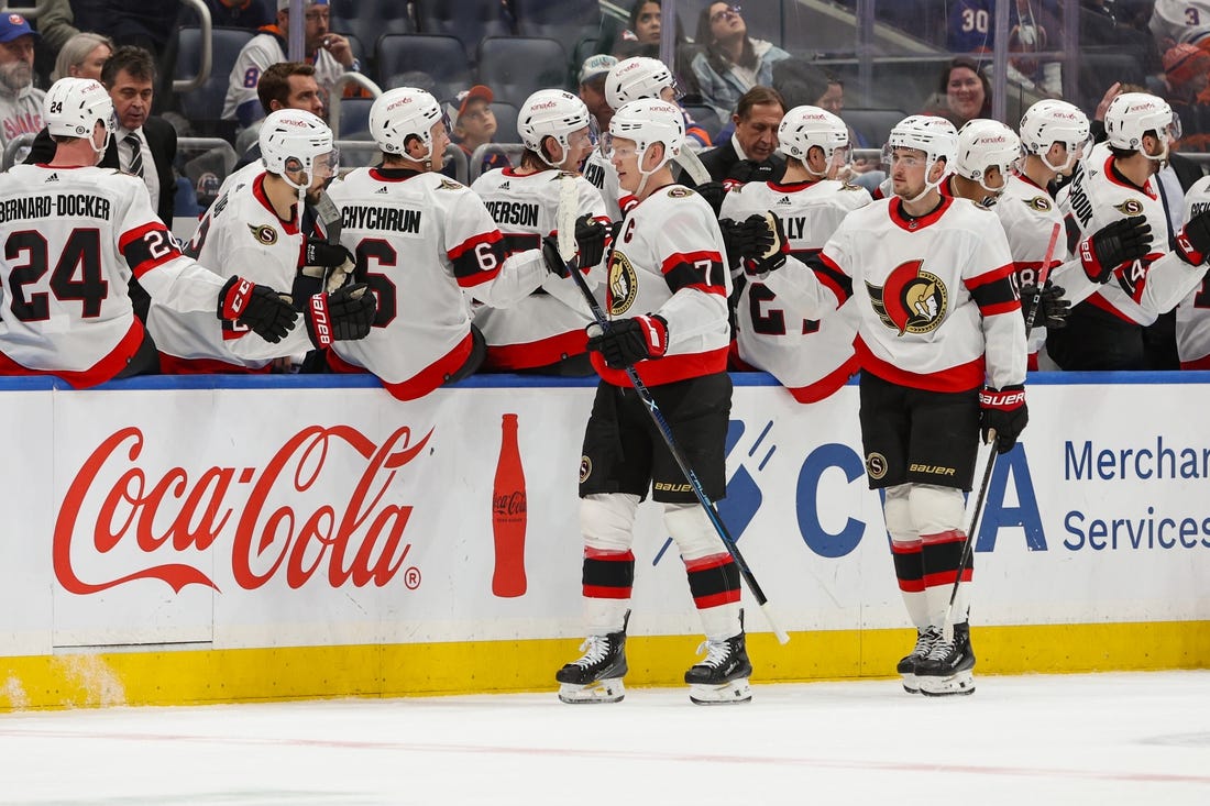 Mar 16, 2024; Elmont, New York, USA;  Ottawa Senators left wing Brady Tkachuk (7) celebrates his goal against the New York Islanders during the second period at UBS Arena. Mandatory Credit: Thomas Salus-USA TODAY Sports