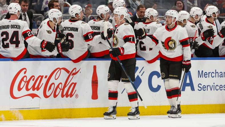 Mar 16, 2024; Elmont, New York, USA;  Ottawa Senators left wing Brady Tkachuk (7) celebrates his goal against the New York Islanders during the second period at UBS Arena. Mandatory Credit: Thomas Salus-USA TODAY Sports