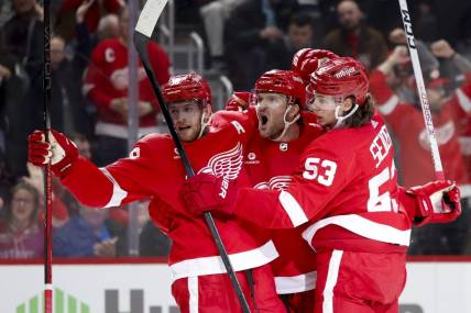 Mar 16, 2024; Detroit, Michigan, USA;  Detroit Red Wings right wing Christian Fischer (36) receives congratulations from center Andrew Copp (18) and defenseman Moritz Seider (53) after scoring in the second period against the Buffalo Sabres at Little Caesars Arena. Mandatory Credit: Rick Osentoski-USA TODAY Sports