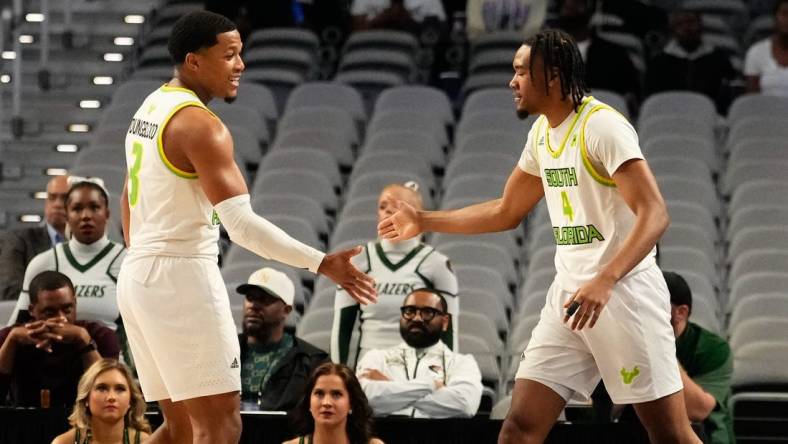 Mar 16, 2024; Fort Worth, TX, USA;  South Florida Bulls guard Kobe Knox (4) celebrates with South Florida Bulls guard Chris Youngblood (3) after scoring a three point basket against the UAB Blazers during the first half at Dickies Arena. Mandatory Credit: Chris Jones-USA TODAY Sports