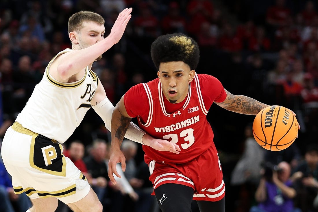 Mar 16, 2024; Minneapolis, MN, USA; Wisconsin Badgers guard Chucky Hepburn (23) works around Purdue Boilermakers guard Braden Smith (3) during the second half at Target Center. Mandatory Credit: Matt Krohn-USA TODAY Sports