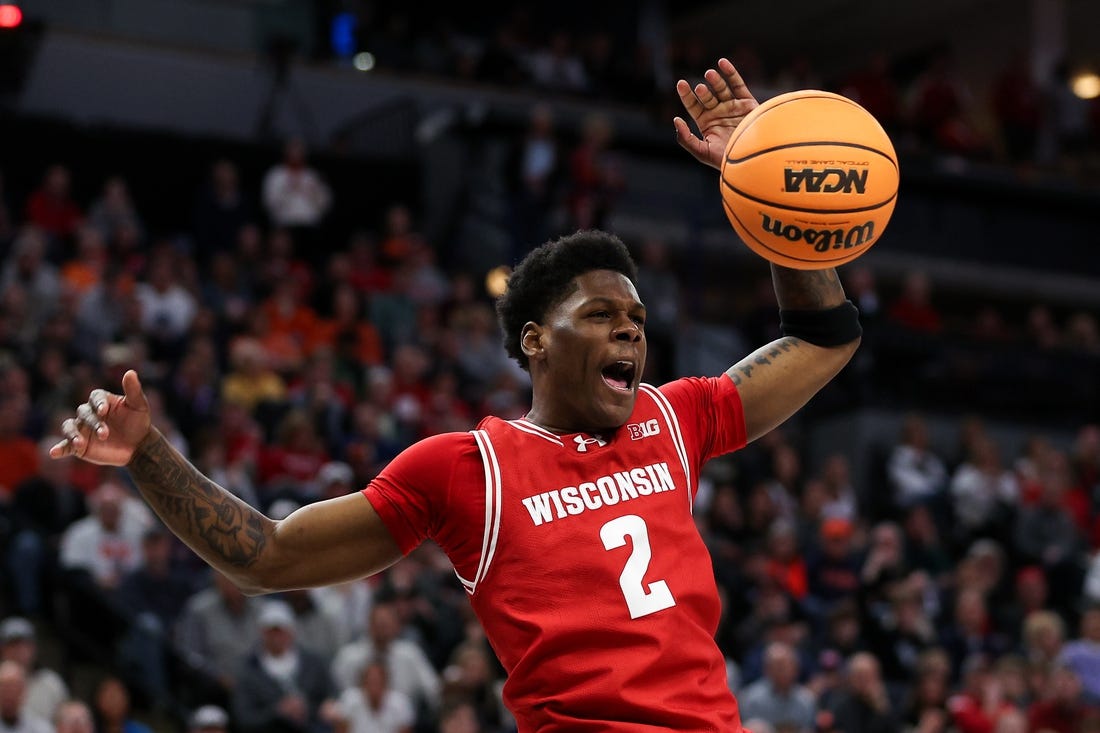 Mar 16, 2024; Minneapolis, MN, USA; Wisconsin Badgers guard AJ Storr (2) celebrates his dunk against the Purdue Boilermakers during the overtime at Target Center. Mandatory Credit: Matt Krohn-USA TODAY Sports