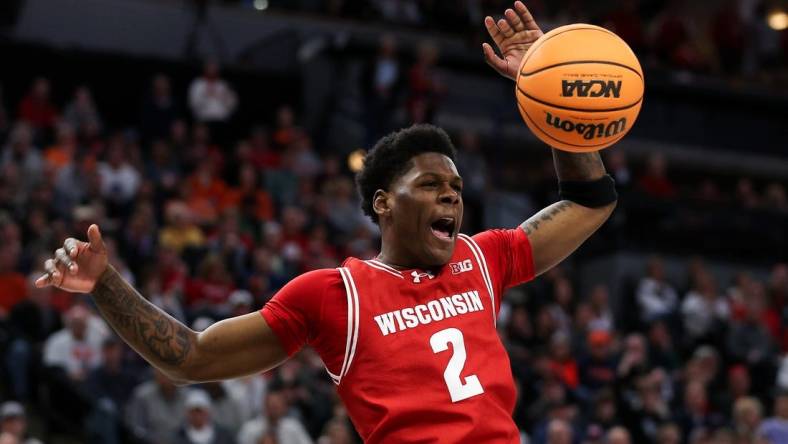 Mar 16, 2024; Minneapolis, MN, USA; Wisconsin Badgers guard AJ Storr (2) celebrates his dunk against the Purdue Boilermakers during the overtime at Target Center. Mandatory Credit: Matt Krohn-USA TODAY Sports