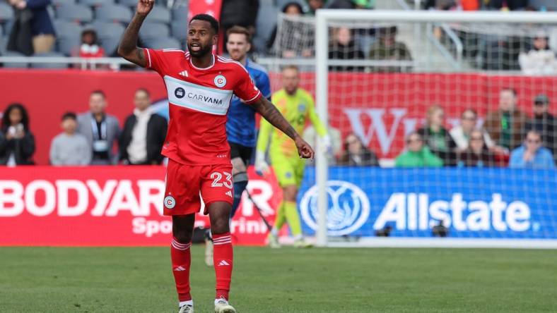 Mar 16, 2024; Chicago, Illinois, USA; Chicago Fire FC midfielder Kellyn Acosta (23) celebrates after scoring a goal on a long kick against CF Montreal during the second half at Soldier Field. Mandatory Credit: Mike Dinovo-USA TODAY Sports