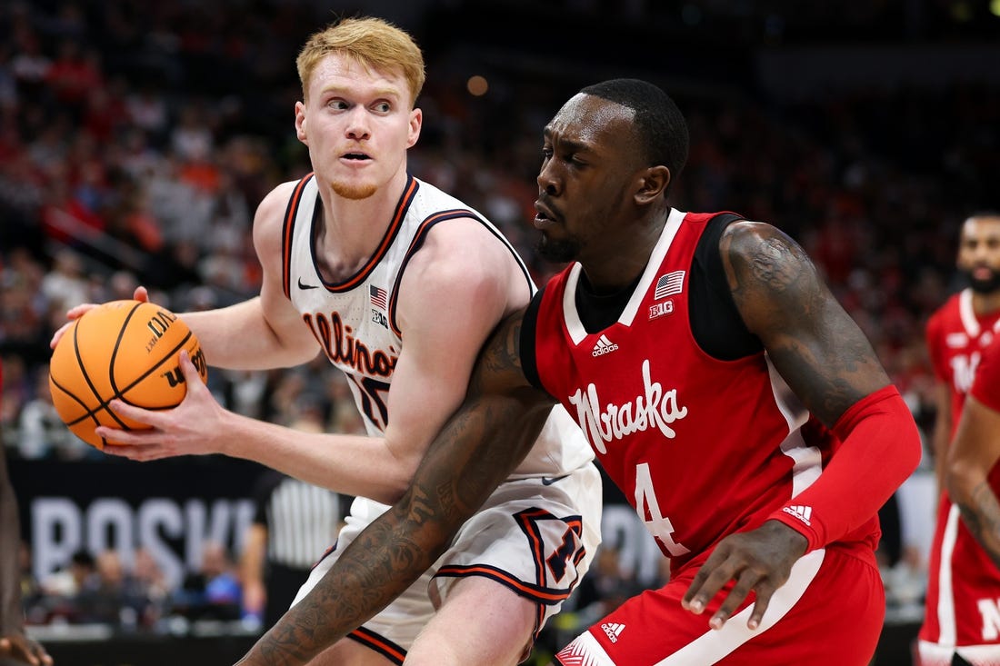 Mar 16, 2024; Minneapolis, MN, USA; Illinois Fighting Illini guard Luke Goode (10) controls the ball as Nebraska Cornhuskers forward Juwan Gary (4) defends during the first half at Target Center. Mandatory Credit: Matt Krohn-USA TODAY Sports