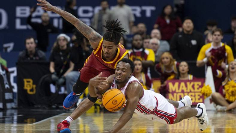 Mar 16, 2024; Kansas City, MO, USA; Iowa State Cyclones guard Keshon Gilbert (10) and Houston Cougars guard LJ Cryer (4) dive for a loose ball in the first half at T-Mobile Center. Mandatory Credit: Amy Kontras-USA TODAY Sports