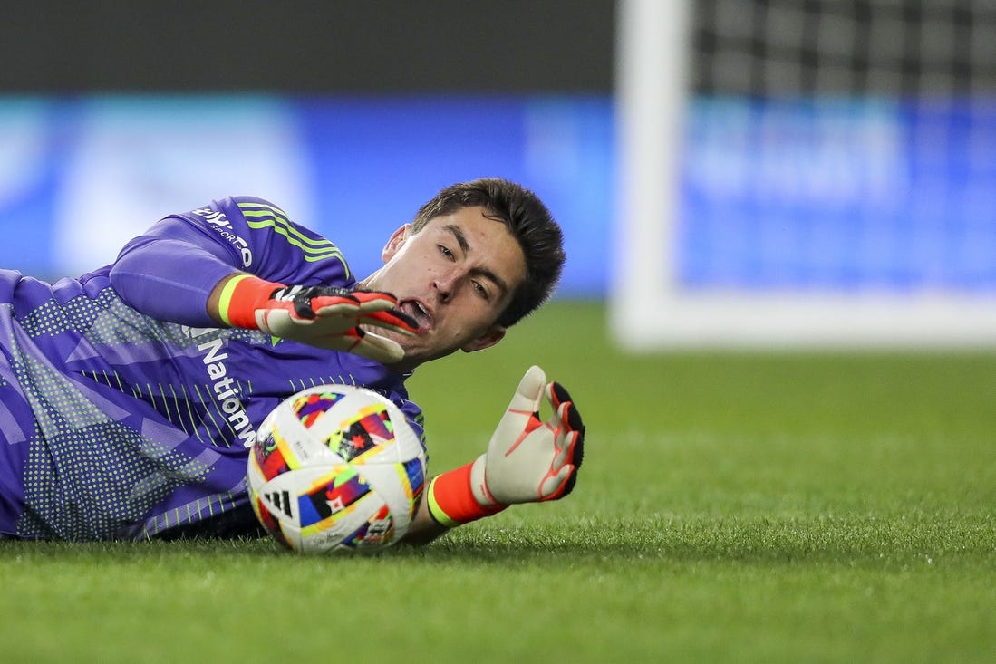 Mar 16, 2024; Columbus, Ohio, USA; Columbus Crew goalkeeper Patrick Schulte (28) makes a save against the New York Red Bulls in the first half at Lower.com Field. Mandatory Credit: Katie Stratman-USA TODAY Sports