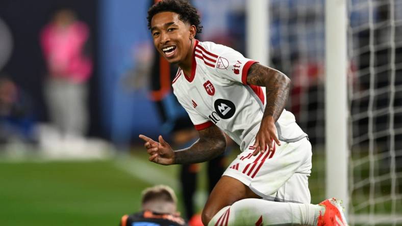 Mar 16, 2024; New York, New York, USA; Toronto FC forward Jahkeele Marshall-Rutty (7) celebrates after scoring a goal against New York City FC during the first half at Yankee Stadium. Mandatory Credit: Mark Smith-USA TODAY Sports