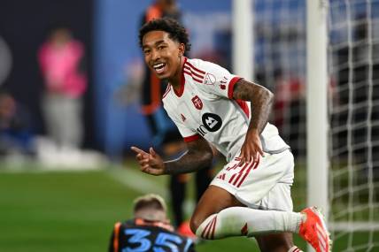 Mar 16, 2024; New York, New York, USA; Toronto FC forward Jahkeele Marshall-Rutty (7) celebrates after scoring a goal against New York City FC during the first half at Yankee Stadium. Mandatory Credit: Mark Smith-USA TODAY Sports