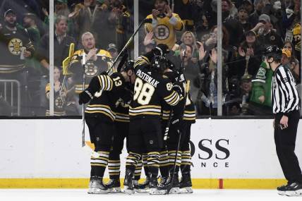 Mar 16, 2024; Boston, Massachusetts, USA; Boston Bruins center Charlie Coyle (13) celebrates his goal with his teammates during the second period against the Philadelphia Flyers at TD Garden. Mandatory Credit: Bob DeChiara-USA TODAY Sports