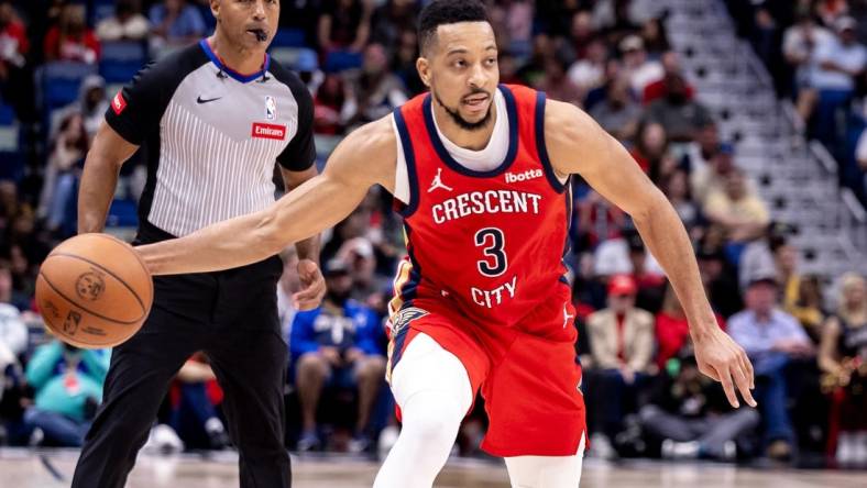 Mar 16, 2024; New Orleans, Louisiana, USA;  New Orleans Pelicans guard CJ McCollum (3) passes the ball against the Portland Trail Blazers during the second half at Smoothie King Center. Mandatory Credit: Stephen Lew-USA TODAY Sports