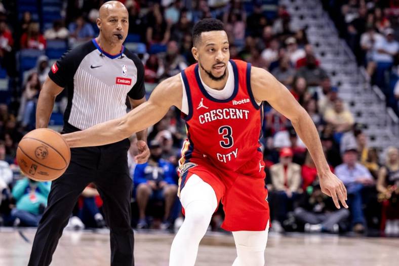 Mar 16, 2024; New Orleans, Louisiana, USA;  New Orleans Pelicans guard CJ McCollum (3) passes the ball against the Portland Trail Blazers during the second half at Smoothie King Center. Mandatory Credit: Stephen Lew-USA TODAY Sports