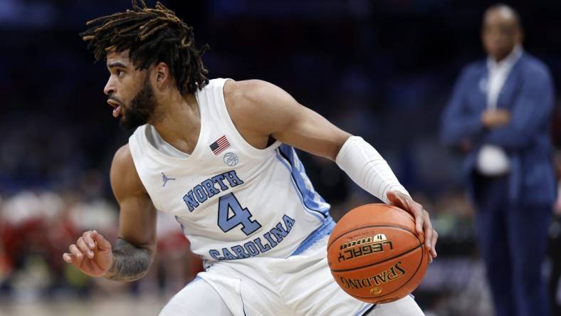 Mar 16, 2024; Washington, D.C., USA; North Carolina Tar Heels guard RJ Davis (4) dribbles the ball against the North Carolina State Wolfpack during the second half at Capital One Arena. Mandatory Credit: Geoff Burke-USA TODAY Sports