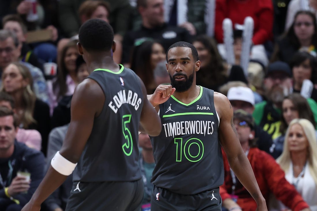 Mar 16, 2024; Salt Lake City, Utah, USA; Minnesota Timberwolves guard Mike Conley (10) reacts to a play against the Utah Jazz with guard Anthony Edwards (5) during the second quarter at Delta Center. Mandatory Credit: Rob Gray-USA TODAY Sports