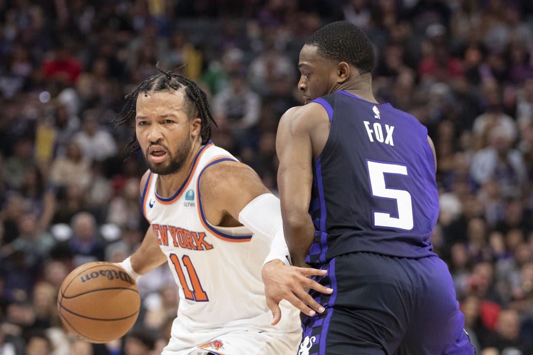 March 16, 2024; Sacramento, California, USA; New York Knicks guard Jalen Brunson (11) dribbles the basketball against Sacramento Kings guard De'Aaron Fox (5) during the second quarter at Golden 1 Center. Mandatory Credit: Kyle Terada-USA TODAY Sports