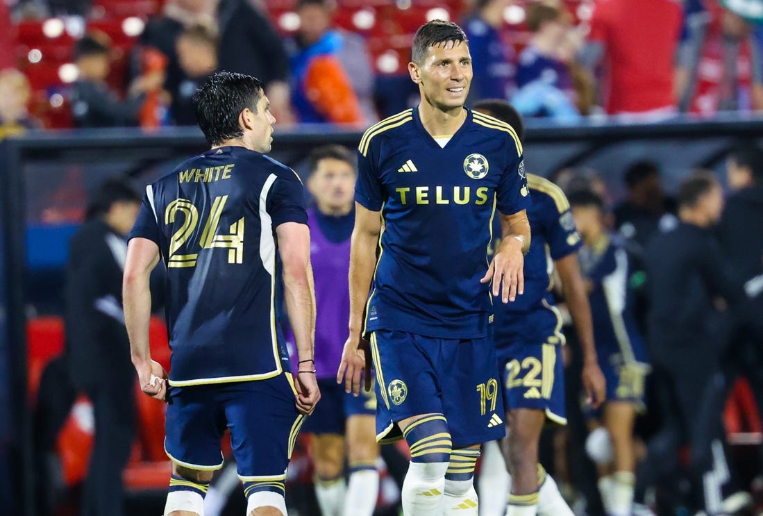 Mar 16, 2024; Frisco, Texas, USA; Vancouver Whitecaps FC forward Brian White (24) celebrates with Vancouver Whitecaps FC midfielder Damir Kreilach (19) after the game against FC Dallas at Toyota Stadium. Mandatory Credit: Kevin Jairaj-USA TODAY Sports