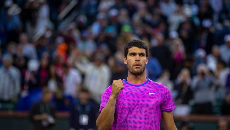 Carlos Alcaraz celebrates his match win over Jannik Sinner during the ATP semifinals of the BNP Paribas Open in Indian Wells, Calif., Saturday, March 16, 2024.