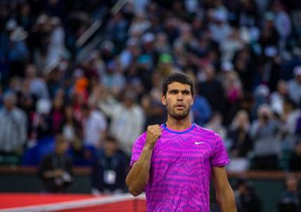 Carlos Alcaraz celebrates his match win over Jannik Sinner during the ATP semifinals of the BNP Paribas Open in Indian Wells, Calif., Saturday, March 16, 2024.