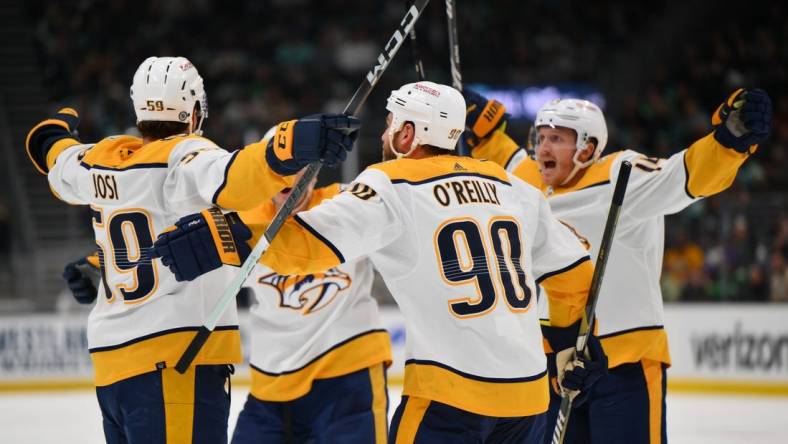 Mar 16, 2024; Seattle, Washington, USA; The Nashville Predators celebrate after defenseman Roman Josi (59) scored a goal against the Seattle Kraken during the third period at Climate Pledge Arena. Mandatory Credit: Steven Bisig-USA TODAY Sports