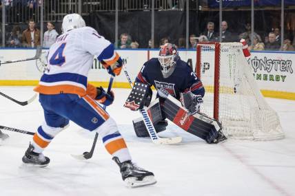 Mar 17, 2024; New York, New York, USA; New York Rangers goaltender Igor Shesterkin (31) defends the goal against New York Islanders center Bo Horvat (14) during the first period at Madison Square Garden. Mandatory Credit: Vincent Carchietta-USA TODAY Sports