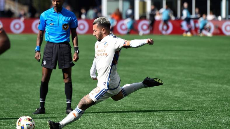 Mar 17, 2024; Foxborough, Massachusetts, USA; FC Cincinnati midfielder Luciano Acosta (10) scores a goal against the New England Revolution during the second half at Gillette Stadium. Mandatory Credit: Bob DeChiara-USA TODAY Sports