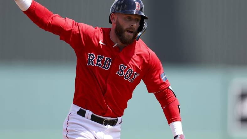 Mar 17, 2024; Fort Myers, Florida, USA;  Boston Red Sox shortstop Trevor Story (10) runs the bases after hitting a three-run home run against the New York Yankees in the first inning at JetBlue Park at Fenway South. Mandatory Credit: Nathan Ray Seebeck-USA TODAY Sports