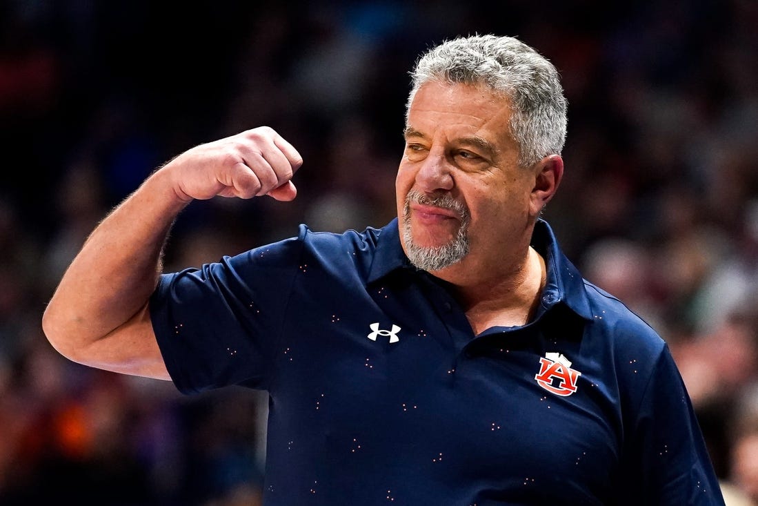 Auburn head coach Bruce Pearl celebrates during the second half of the SEC tournament championship game against Florida at Bridgestone Arena in Nashville, Tenn., Sunday, March 17, 2024.