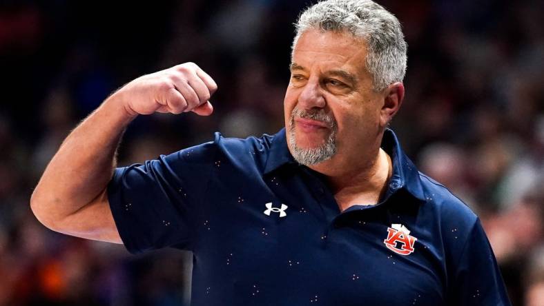 Auburn head coach Bruce Pearl celebrates during the second half of the SEC tournament championship game against Florida at Bridgestone Arena in Nashville, Tenn., Sunday, March 17, 2024.