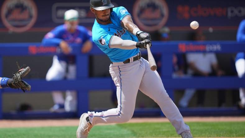 Mar 17, 2024; Port St. Lucie, Florida, USA;  Miami Marlins center fielder Dane Myers (54) hits a home run in the third inning against New York Mets at Clover Park. Mandatory Credit: Jim Rassol-USA TODAY Sports