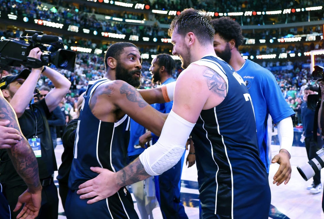 Mar 17, 2024; Dallas, Texas, USA;  Dallas Mavericks guard Kyrie Irving (11) celebrates with Dallas Mavericks guard Luka Doncic (77) after the win against the Denver Nuggets at American Airlines Center. Mandatory Credit: Kevin Jairaj-USA TODAY Sports