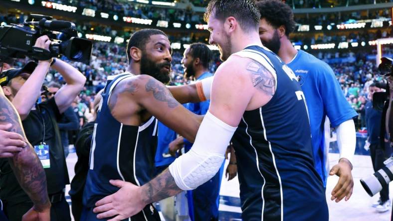 Mar 17, 2024; Dallas, Texas, USA;  Dallas Mavericks guard Kyrie Irving (11) celebrates with Dallas Mavericks guard Luka Doncic (77) after the win against the Denver Nuggets at American Airlines Center. Mandatory Credit: Kevin Jairaj-USA TODAY Sports