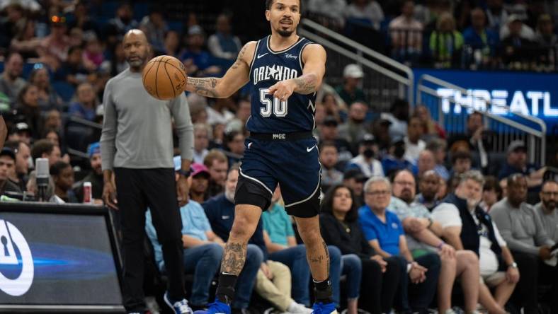 Mar 17, 2024; Orlando, Florida, USA; Orlando Magic guard Cole Anthony (50) dribbles the ball against the Toronto Raptors in the second quarter  at KIA Center. Mandatory Credit: Jeremy Reper-USA TODAY Sports
