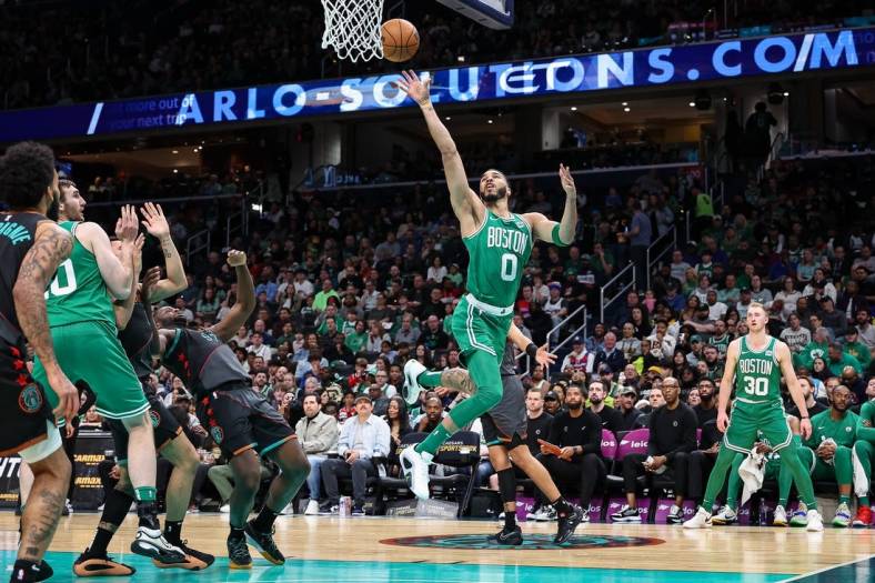 Mar 17, 2024; Washington, District of Columbia, USA; Boston Celtics forward Jayson Tatum (0) goes to the basket against the Washington Wizards during the first half of the game at Capital One Arena. Mandatory Credit: Scott Taetsch-USA TODAY Sports