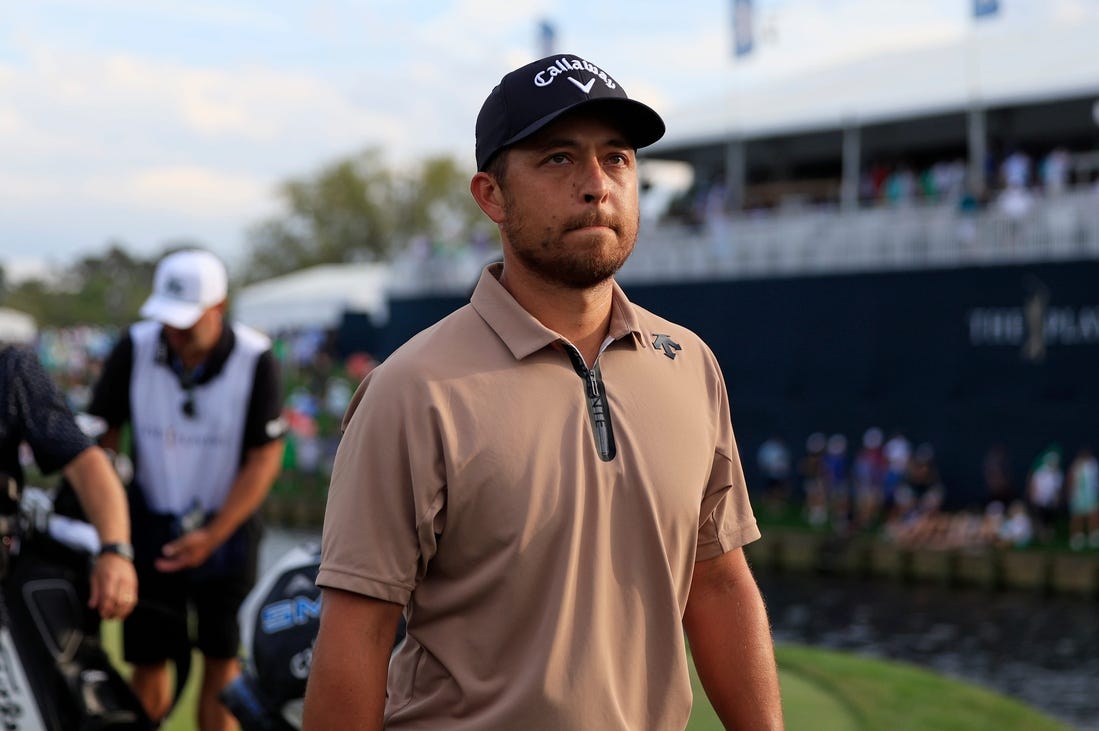 Xander Schauffele walks off hole 18 during the fourth and final round of The Players Championship PGA golf tournament Sunday, March 17, 2024 at TPC Sawgrass in Ponte Vedra Beach, Fla. Scottie Scheffler won at 20 under par and is the first defending champion in the 50 year history of the event. [Corey Perrine/Florida Times-Union]