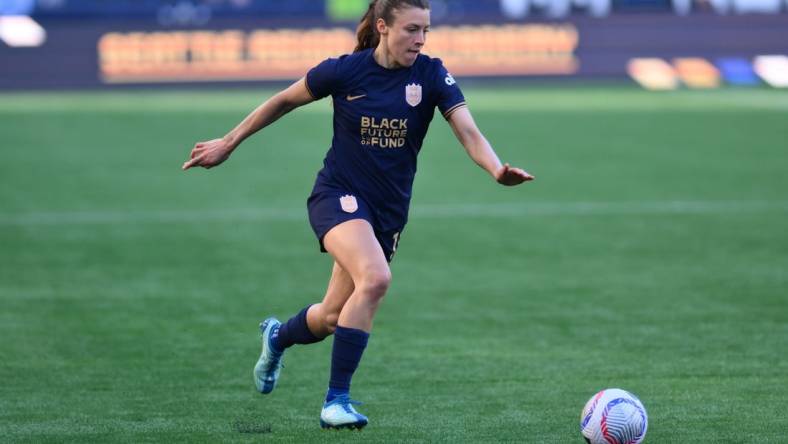 Mar 17, 2024; Seattle, Washington, USA; Seattle Reign defender Sofia Huerta  (11) moves the ball against the Washington Spirit during the second half at Lumen Field. Mandatory Credit: Steven Bisig-USA TODAY Sports