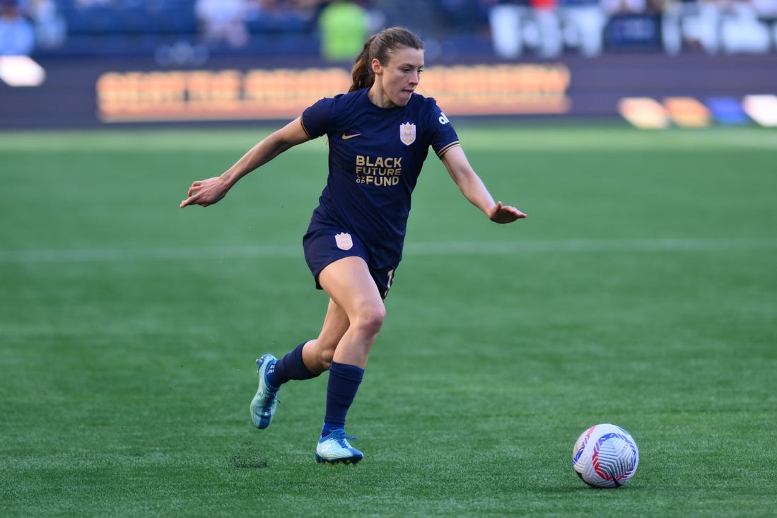 Mar 17, 2024; Seattle, Washington, USA; Seattle Reign defender Sofia Huerta  (11) moves the ball against the Washington Spirit during the second half at Lumen Field. Mandatory Credit: Steven Bisig-USA TODAY Sports