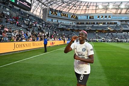 Mar 17, 2024; Los Angeles, California, USA; Bay FC forward Asisat Oshoala (8) celebrates the win over the Angel City FC at BMO Stadium. Mandatory Credit: Kelvin Kuo-USA TODAY Sports